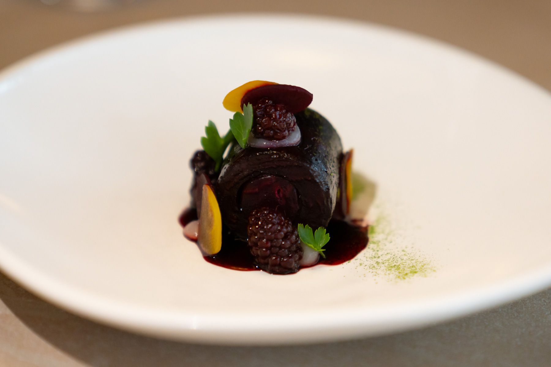 Beetroot cylinder, whipped sugarbeet, silvan berry, parsley.