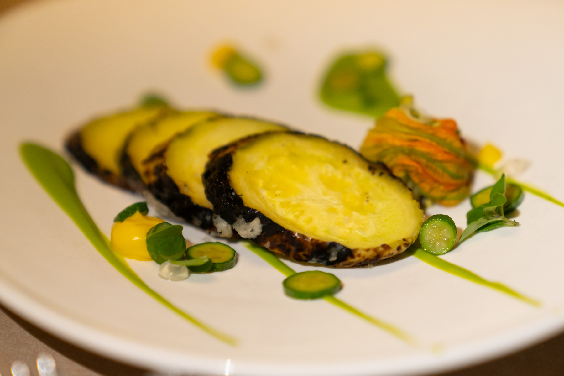 Barbequed tromboncino squash, zucchini flower, marjoram.