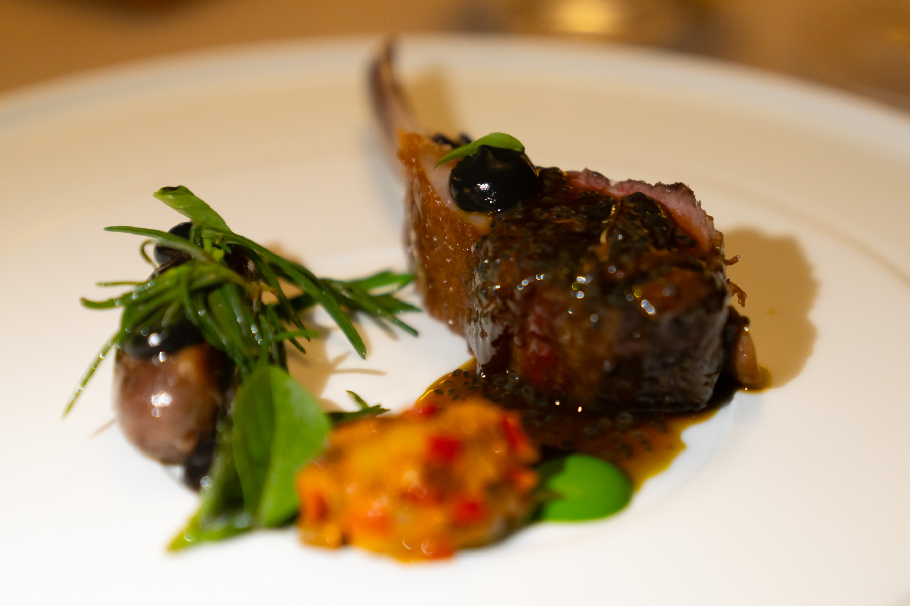 Royal Mail lamb, ratatouille, basil puree, agretti, black olive.