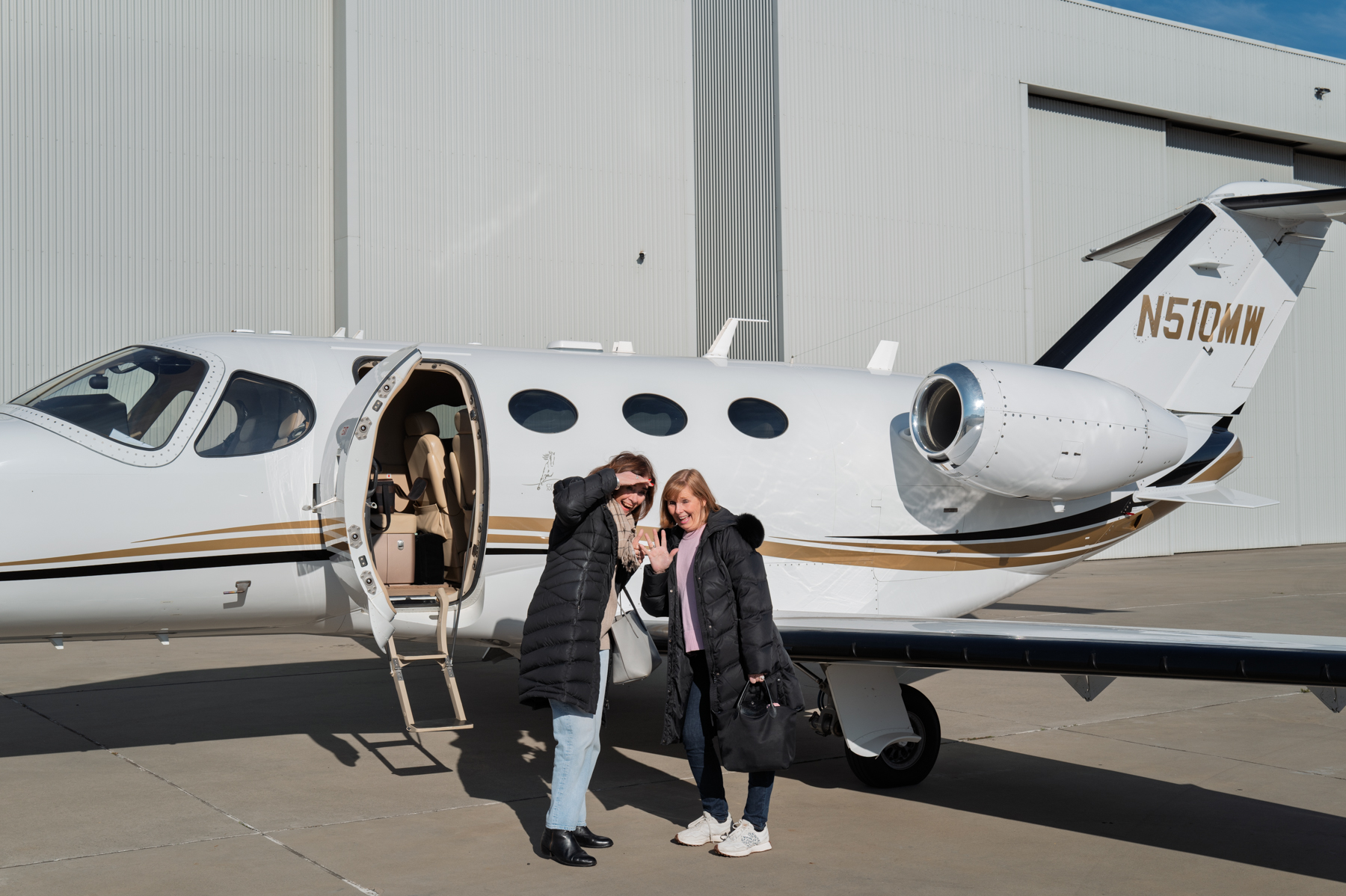 Andrea and Joy about to board the plane.