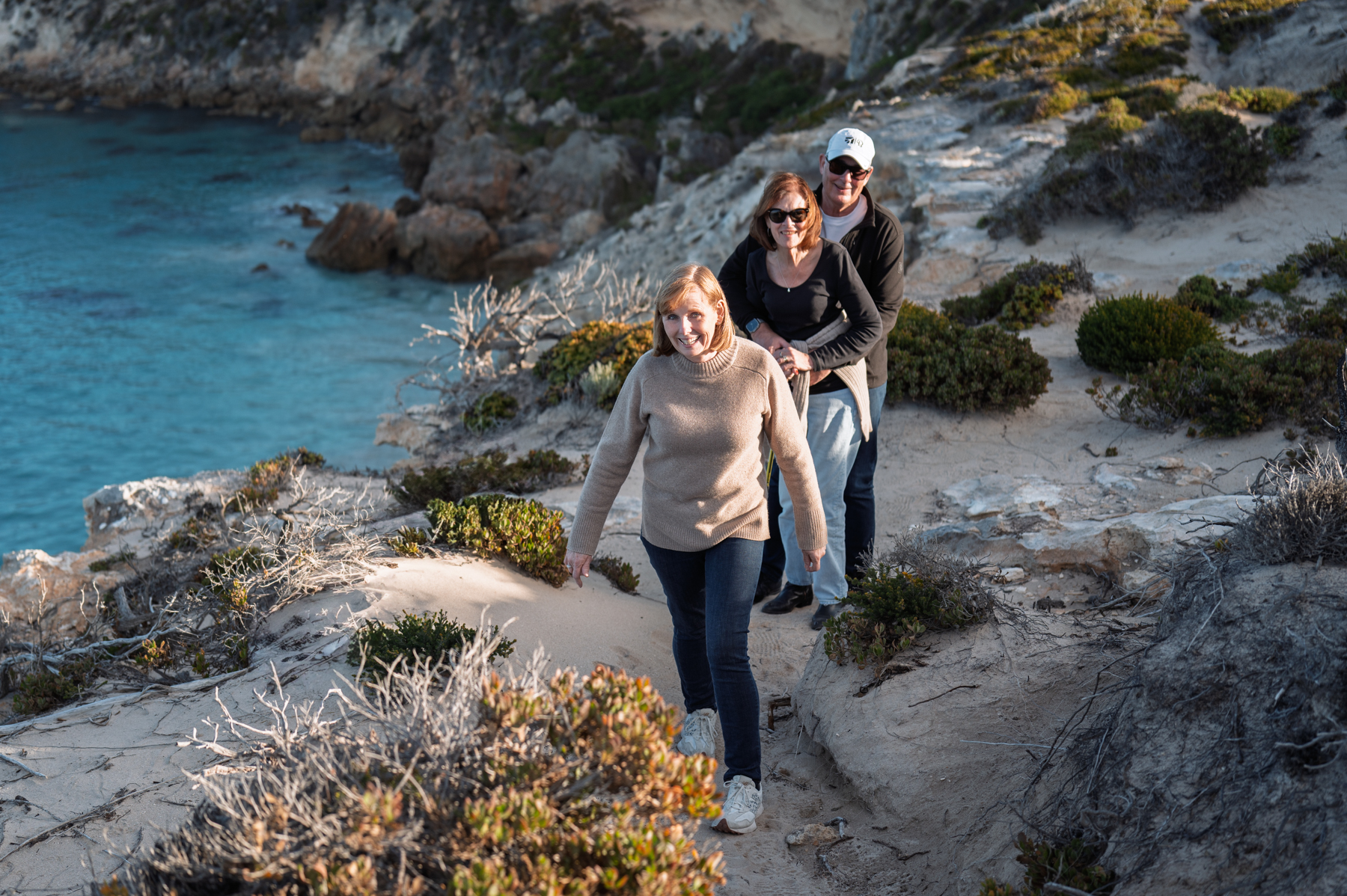 Andrea, Joy, and Peter, walking along the track above Hanson Bay.