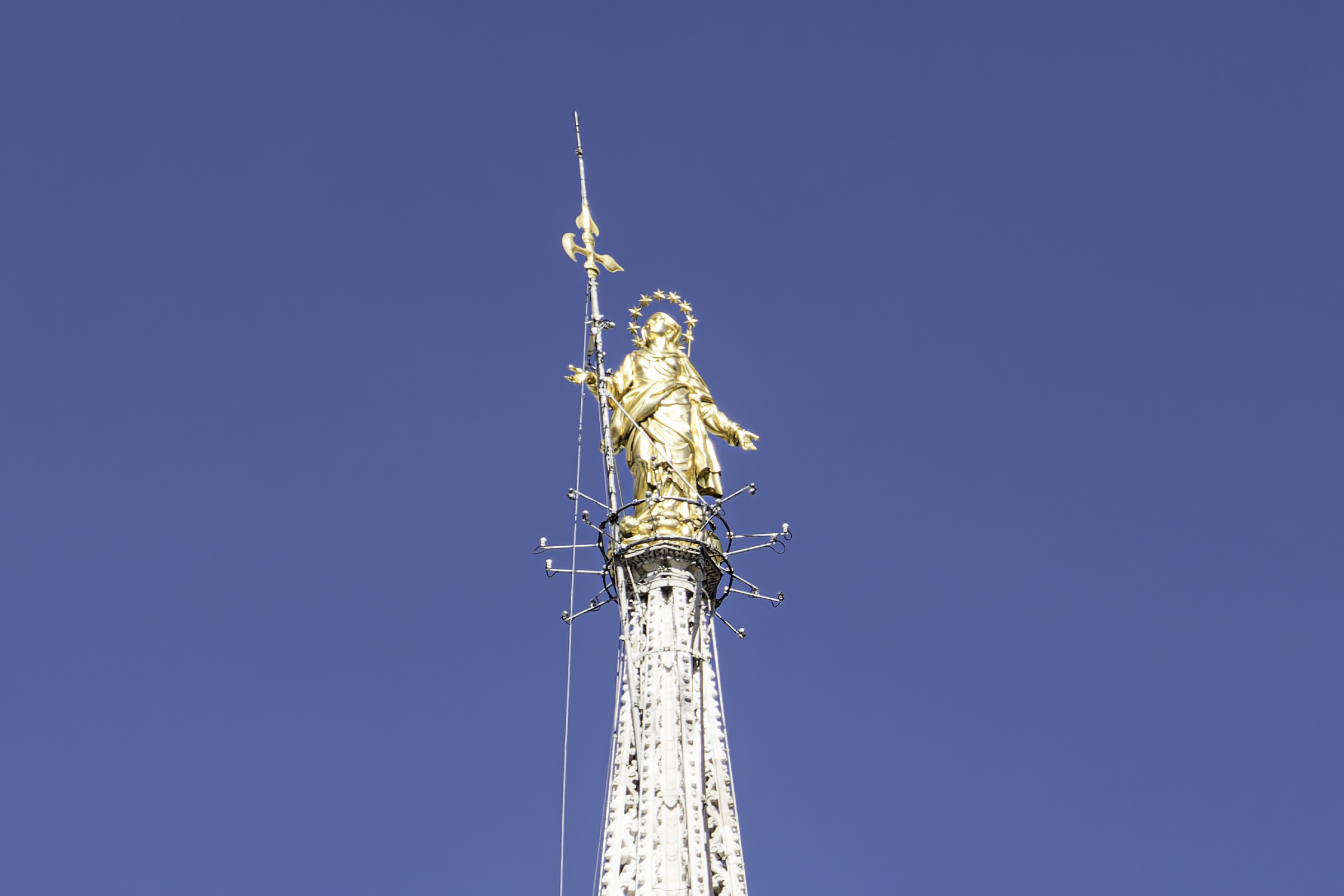 The golden statue of the Virgin Mary atop the Duomo di Milano.
