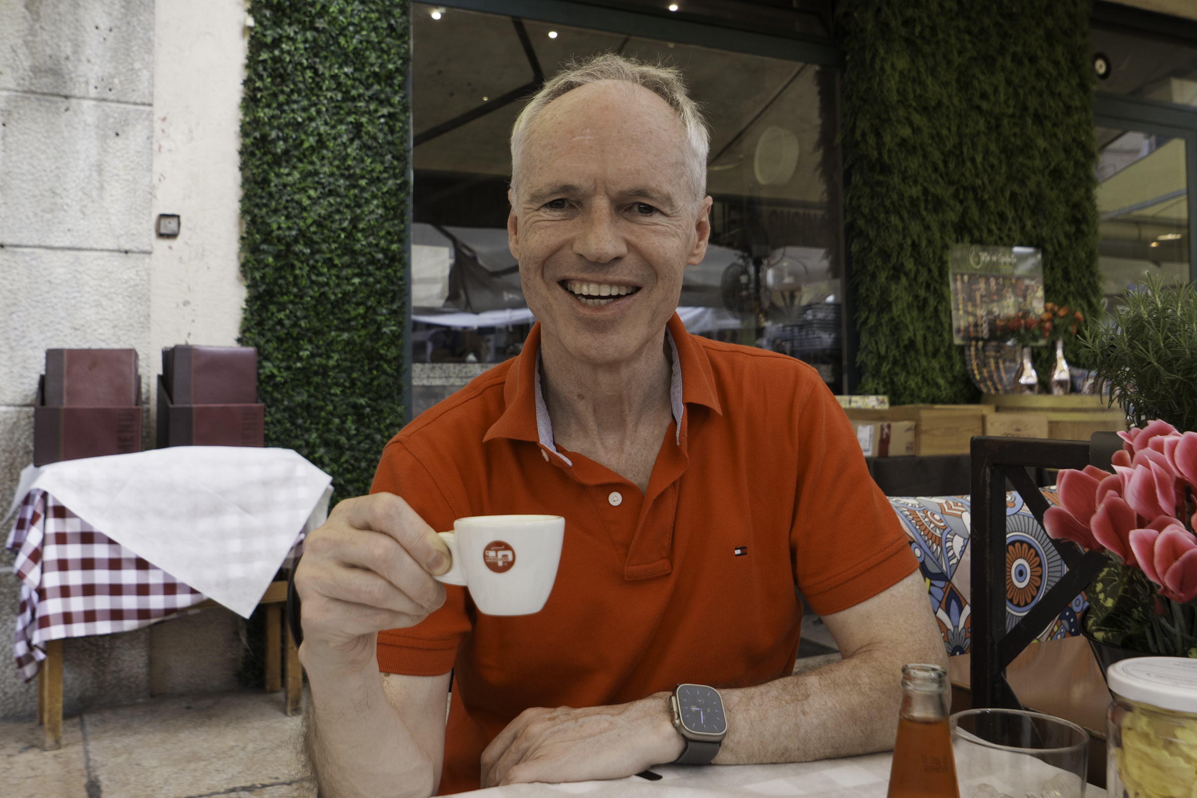 Keith, enjoying an espresso at Piazza delle Erbe.