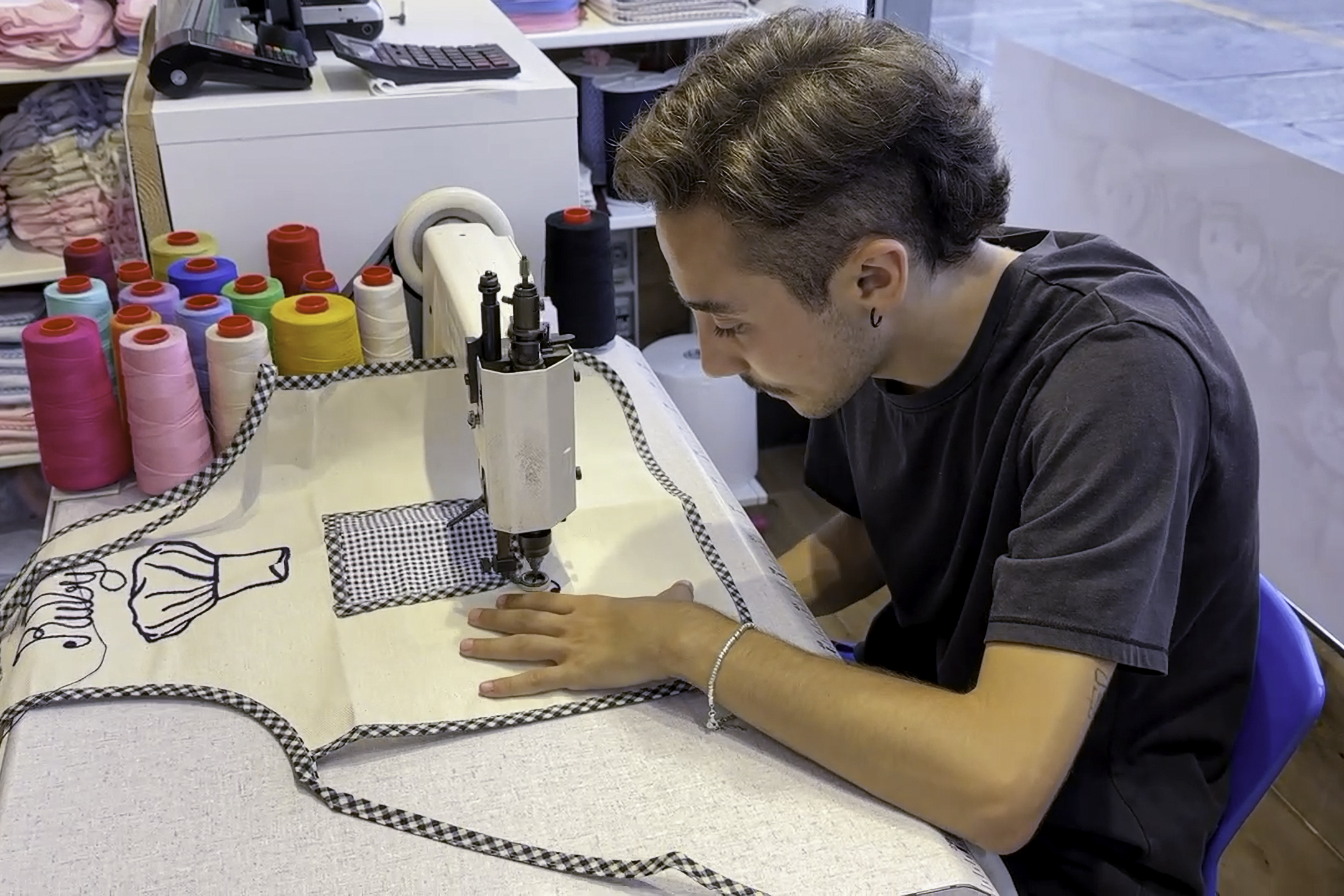 Having our apron custom embroided.