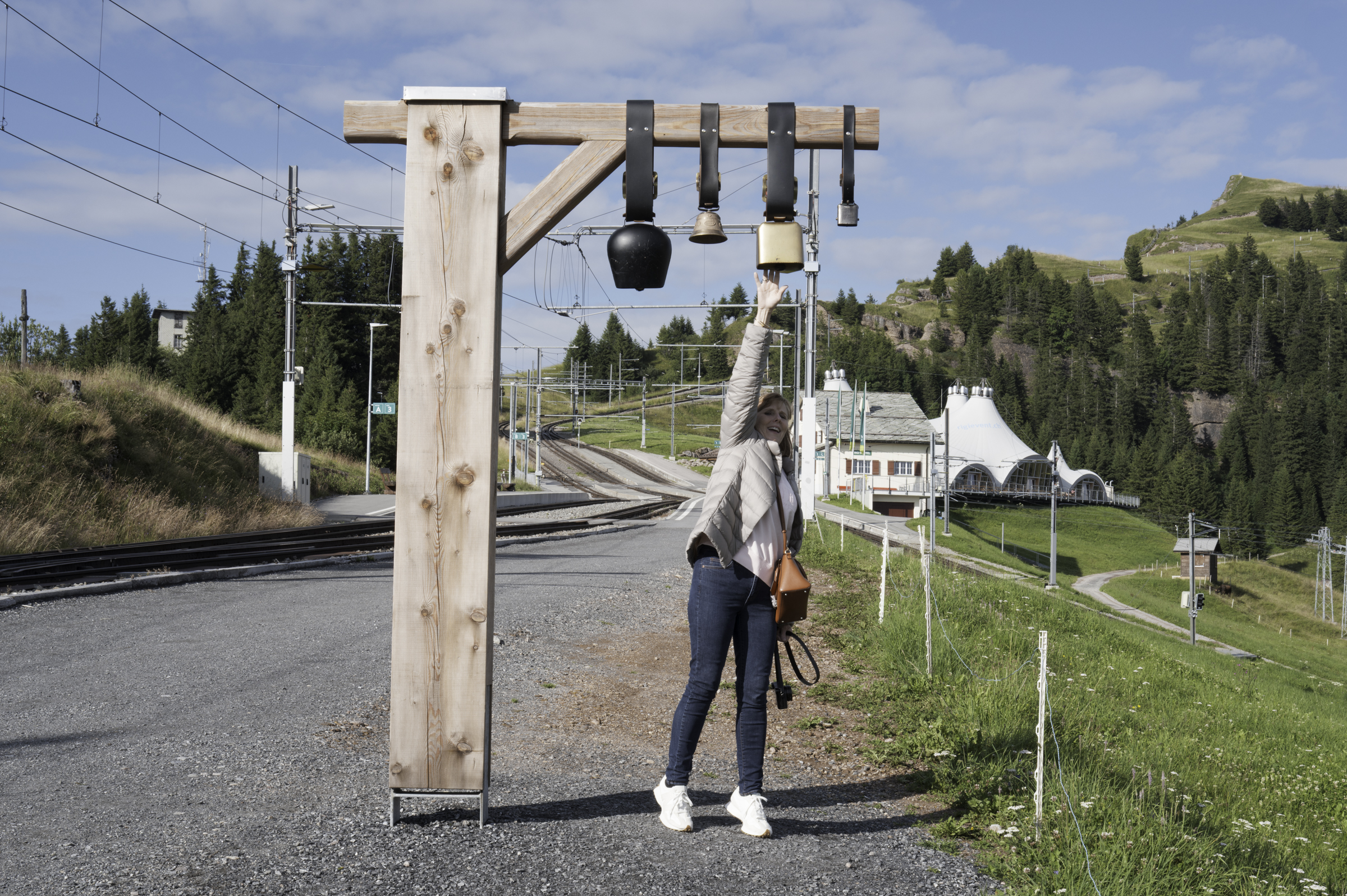 Andrea, testing the cowbell sounds, at Rigi Staffel.