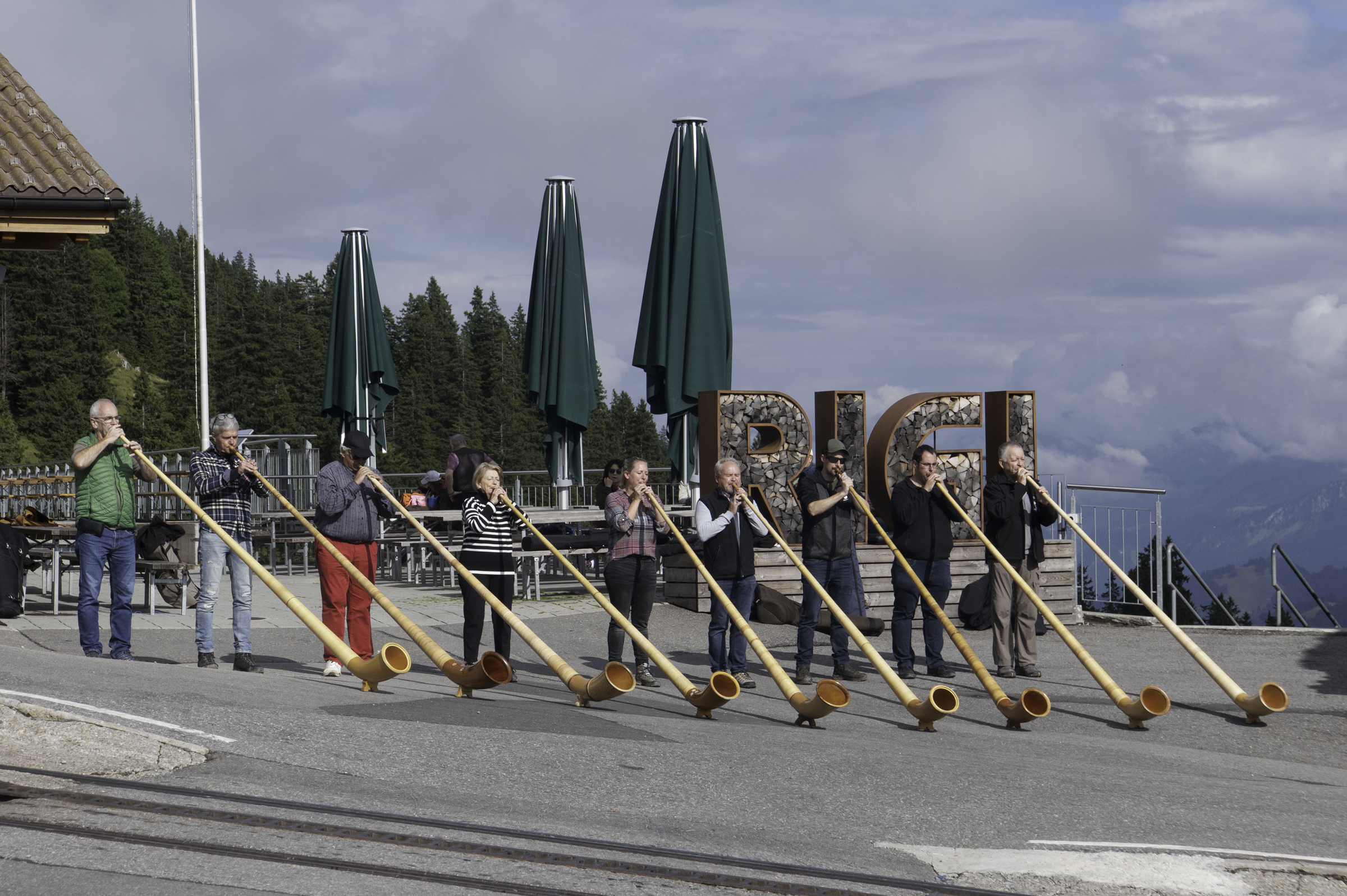 Locals playing the alphorn.