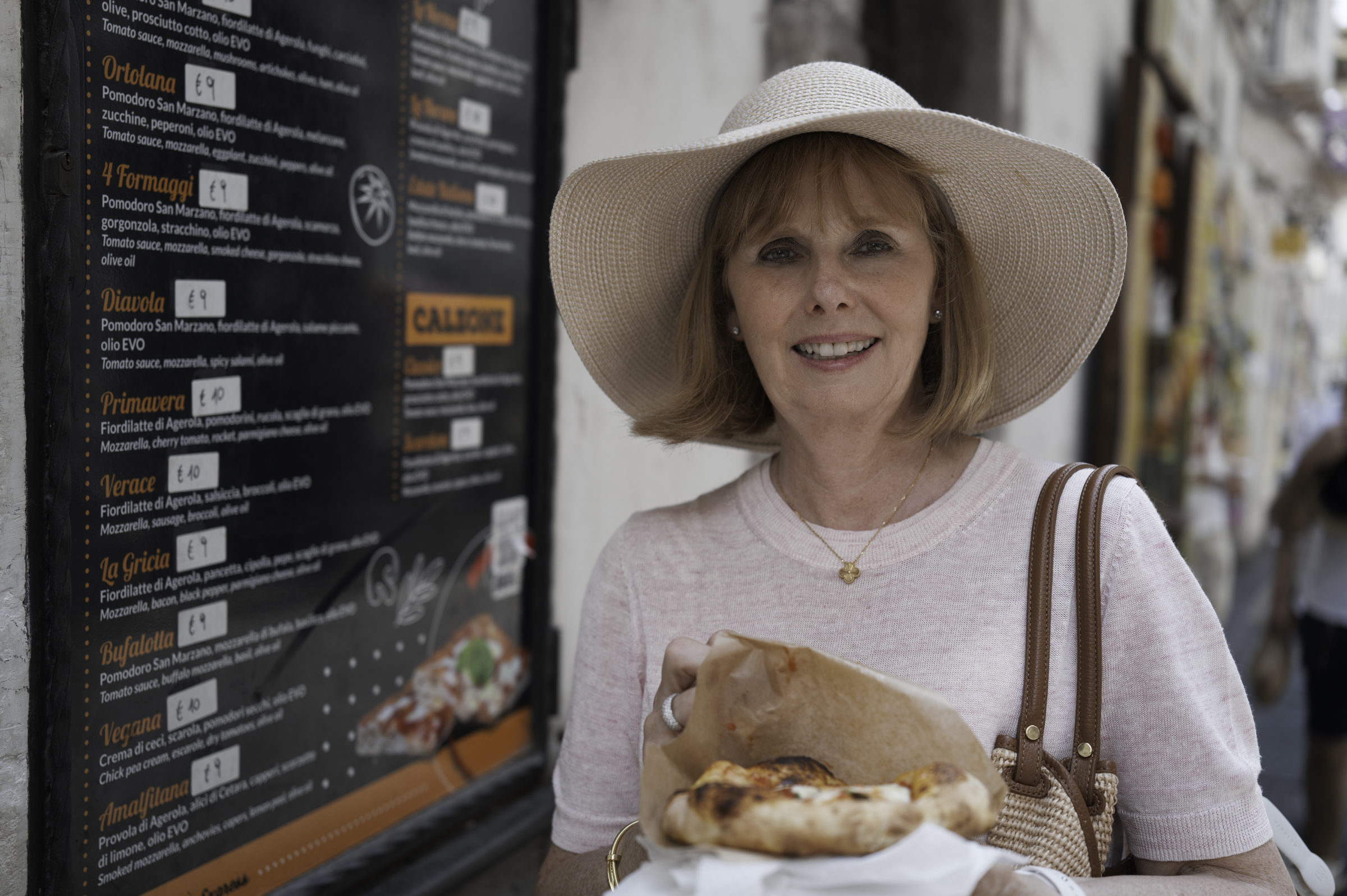 Andrea, about to enjoy a pizza.