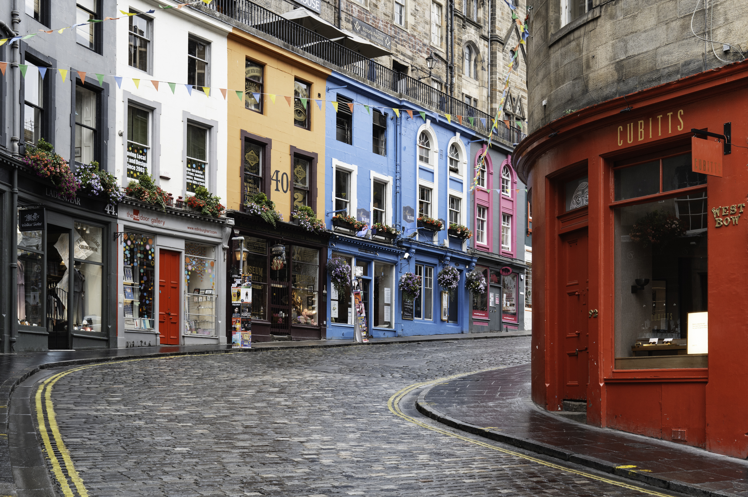 Brightly-coloured shops in W Bow.