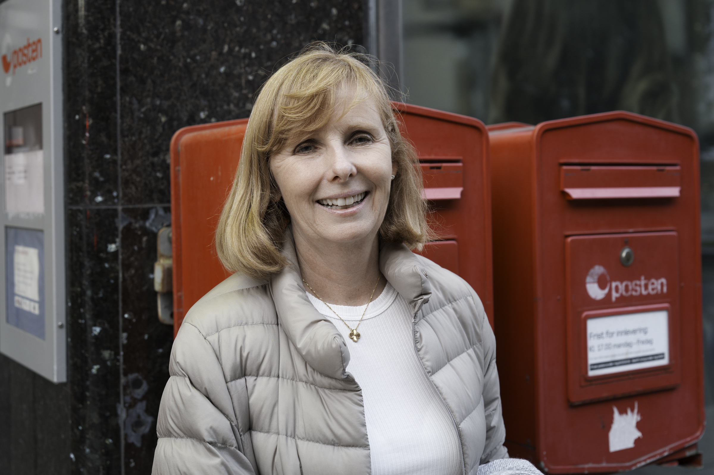 Andrea, at the post office, relieved to be rid of a lot of luggage!