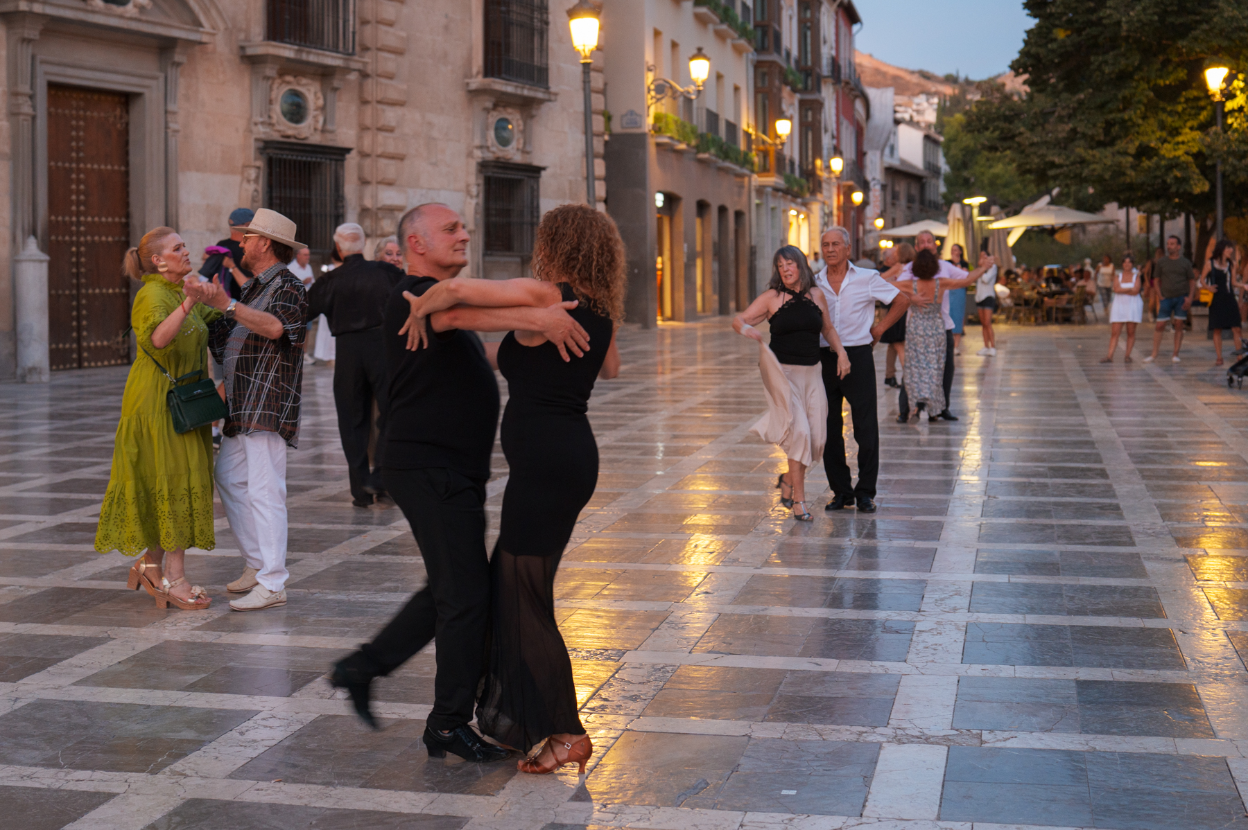Locals dancing in Plaza de Santa Ana in Granada.