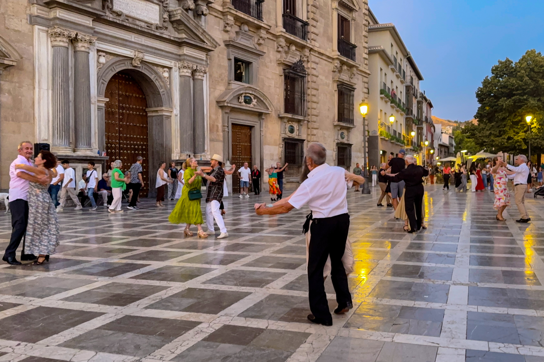 Locals dancing in Plaza de Santa Ana in Granada.