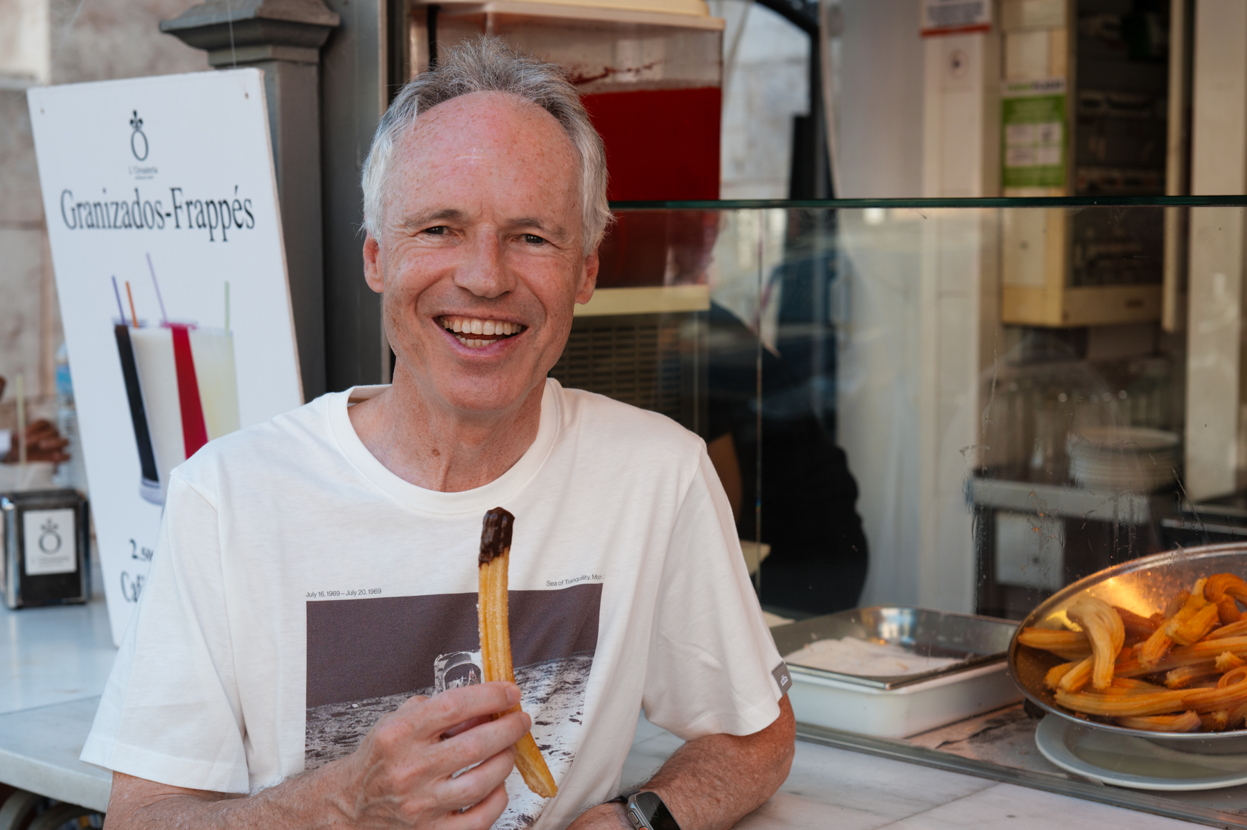 Keith, with a chocolate-dipped churro in Valencia.