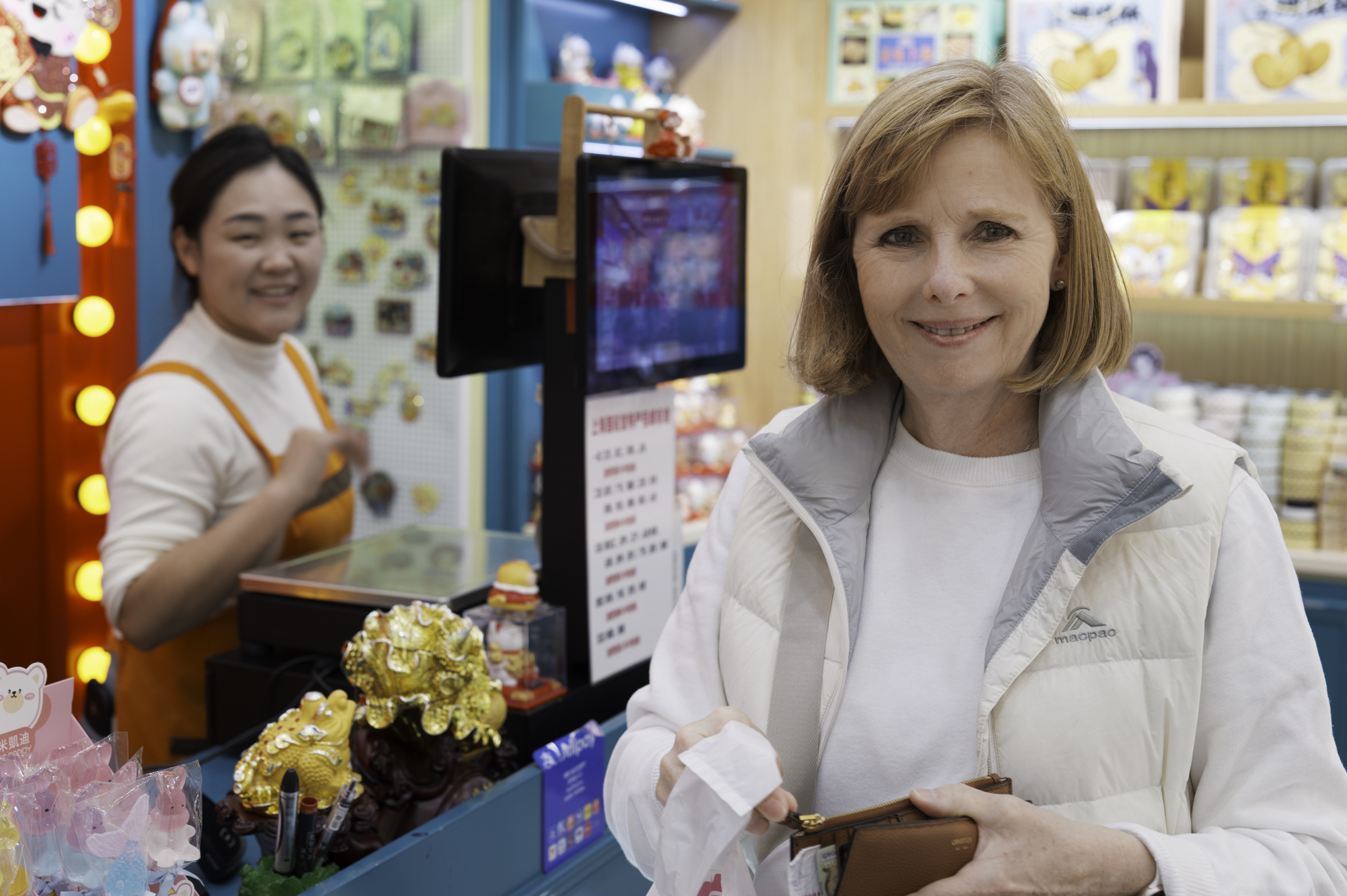 Andrea, buying some White Rabbit sweets in Nanjing Road.