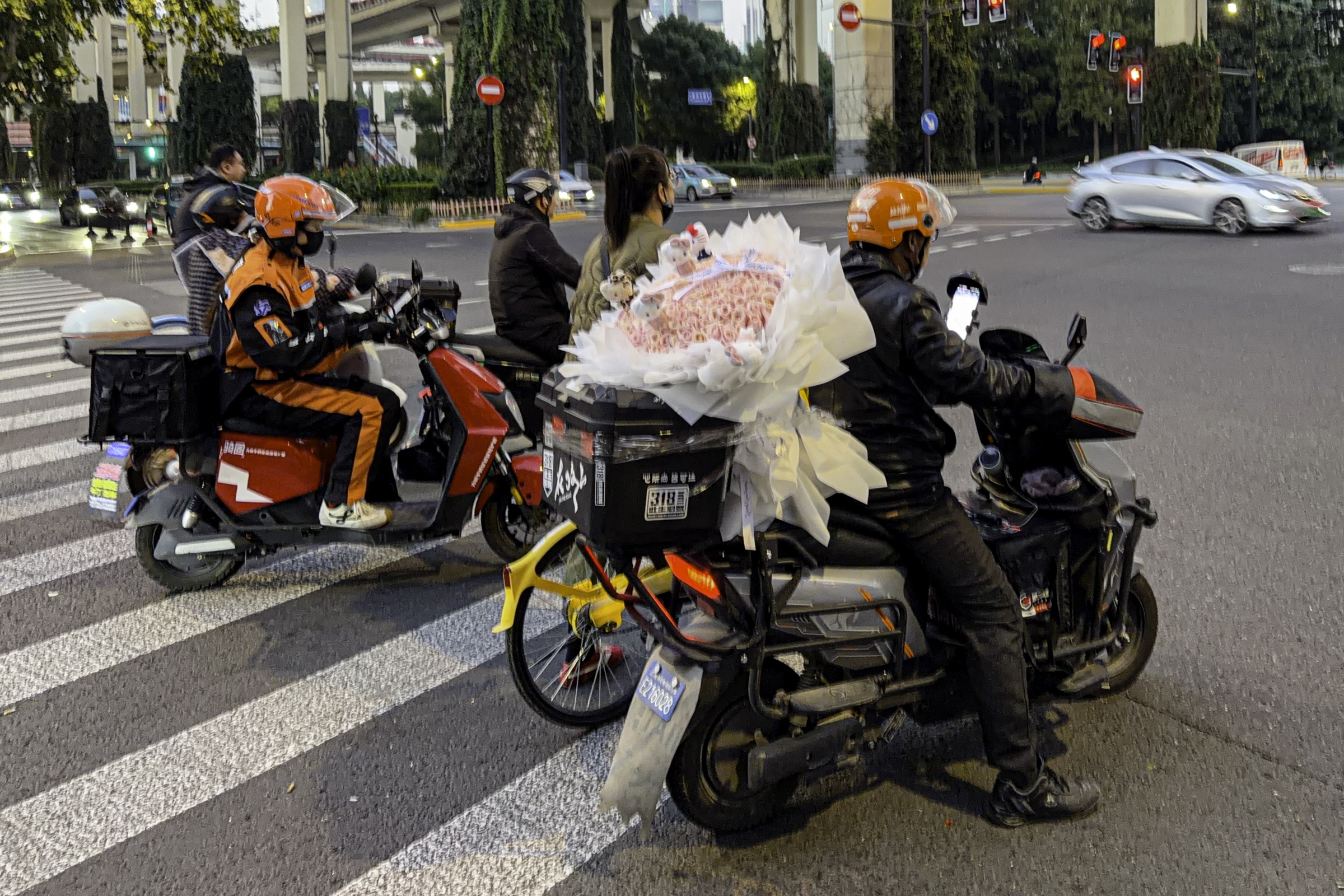 Motor scooters on the street in Shanghai.