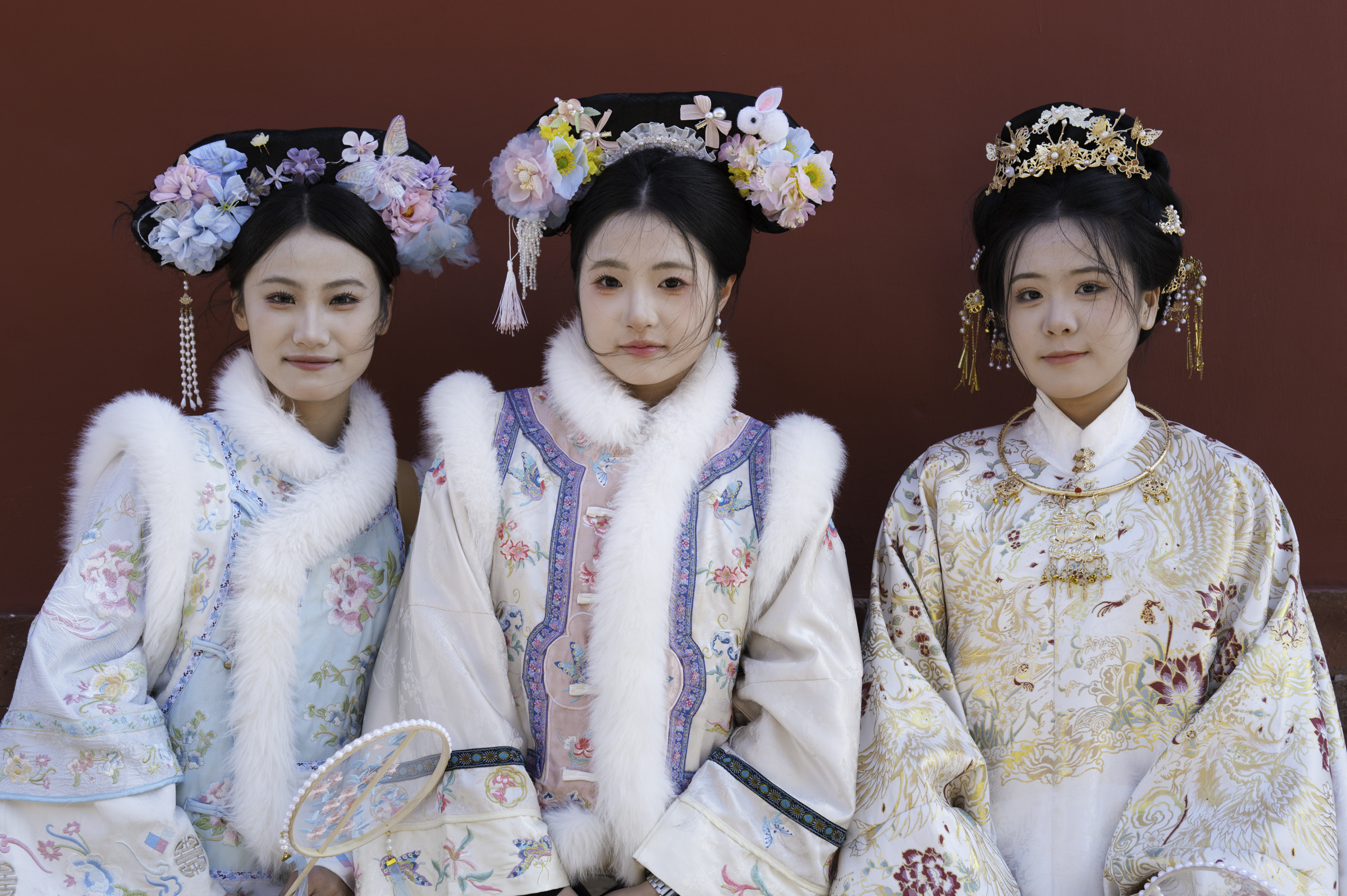 Young girls in traditional dress in the Forbidden City, Beijing.
