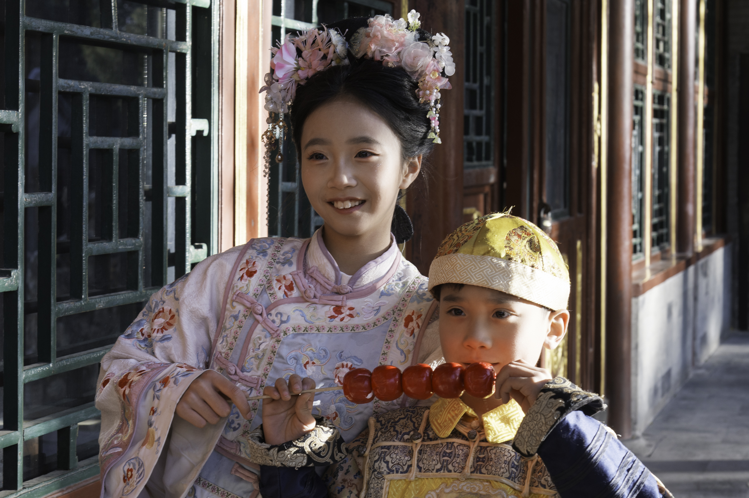 Young girl and boy in traditional dress at the Summer Palace, Beijing.