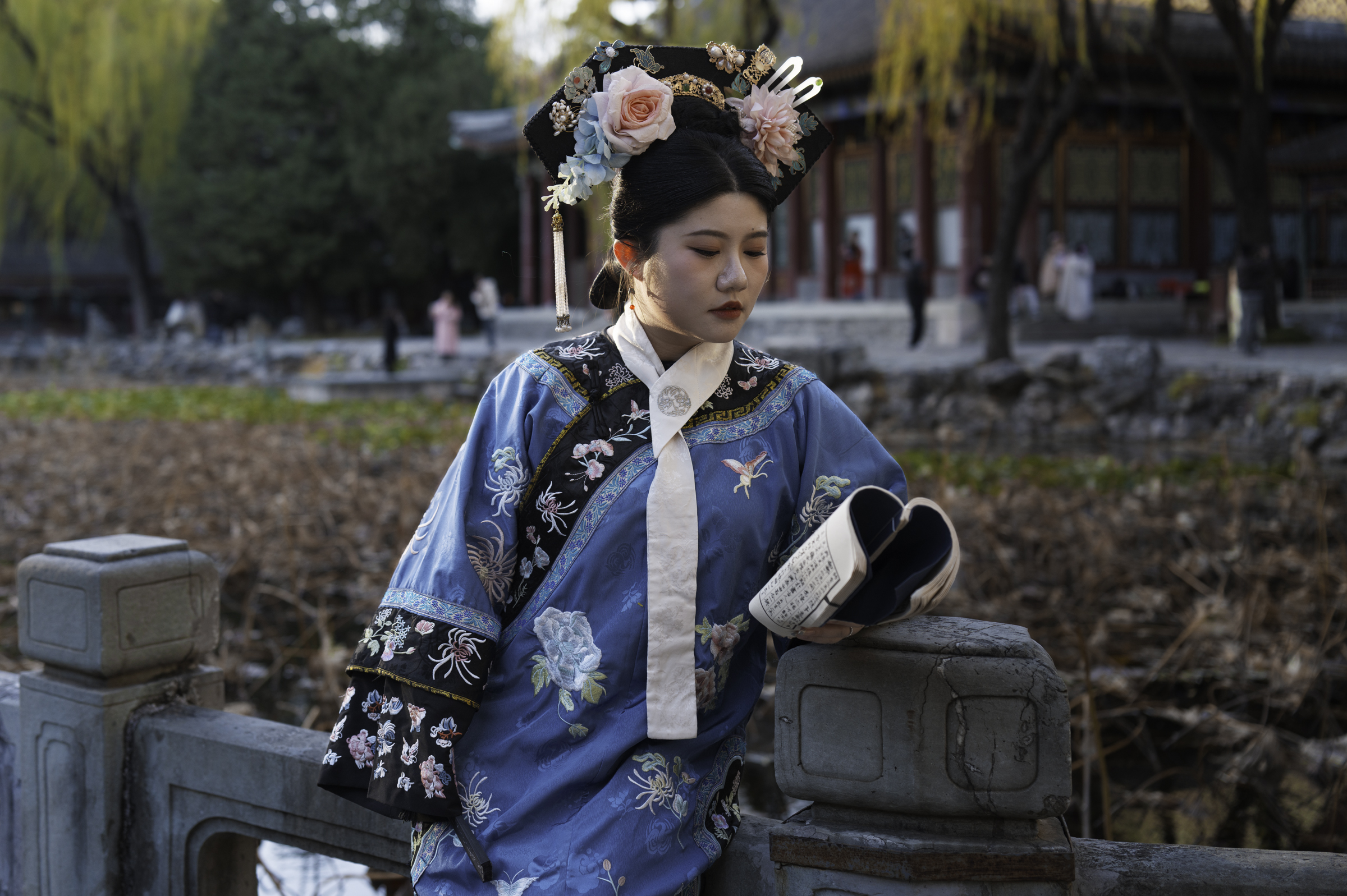 Young girl in traditional dress at the Summer Palace, Beijing.