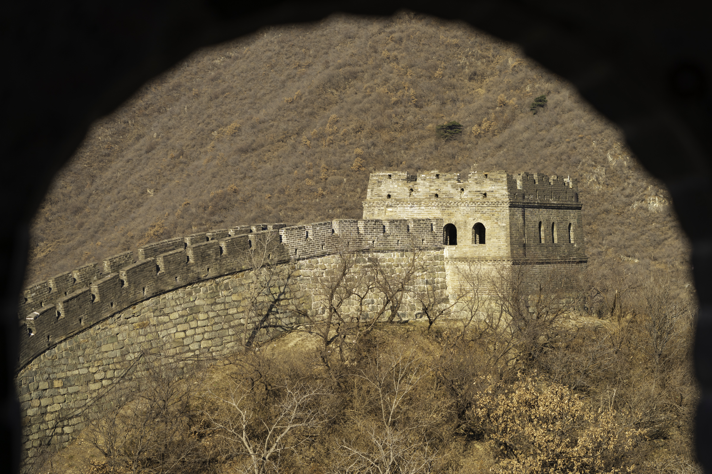 View through a watchtower window on the Great Wall.